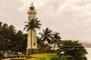 The Galle Light House, perched at the edge of the Indian Ocean, guides ships and boats with its steadfast beam Sri Lanka FootSteps Travel